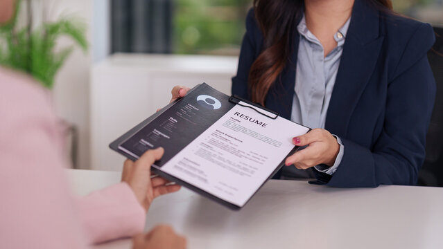 Professional resume and envelope on executive desk