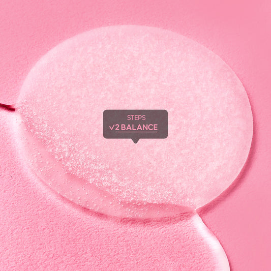 A close-up texture shot of a translucent serum or gel liquid