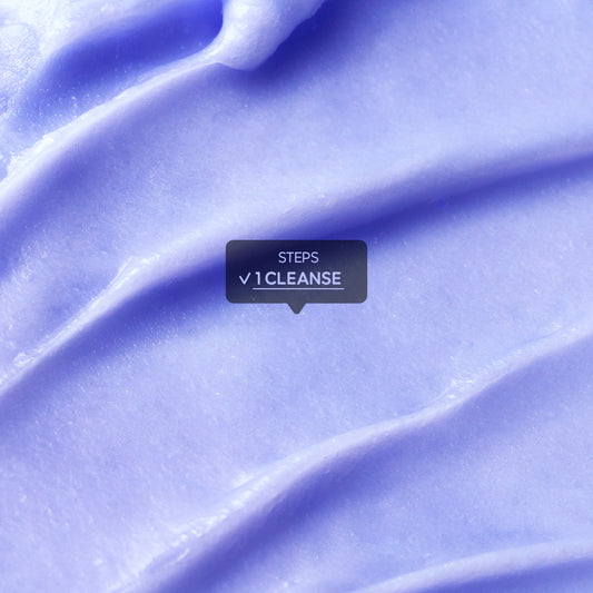 A close-up macro shot of a purple-toned skincare cream texture featuring an educational tooltip overlay.