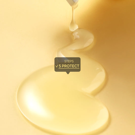 A macro close-up shot of a viscous liquid serum being dispensed